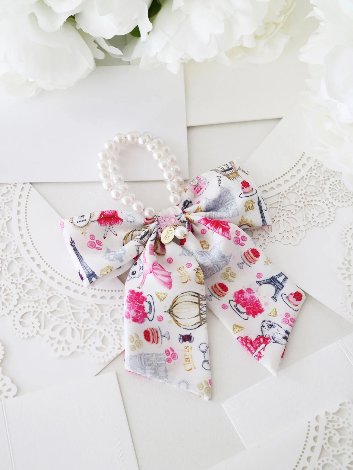 Claris - The Chicest Mouse In Paris™ Fashion Print and Pearl Hair Elastic with Bow